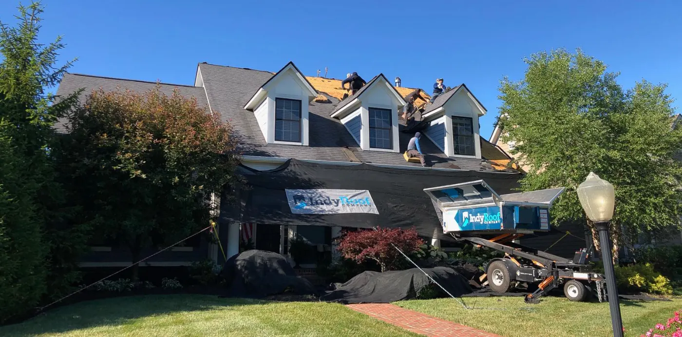 Tarping and dry-in on a Sweetbriar commercial roof